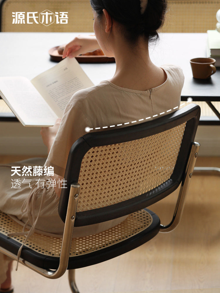 实木黑色餐椅ins休闲不锈钢悬浮椅子藤编复古弓形椅